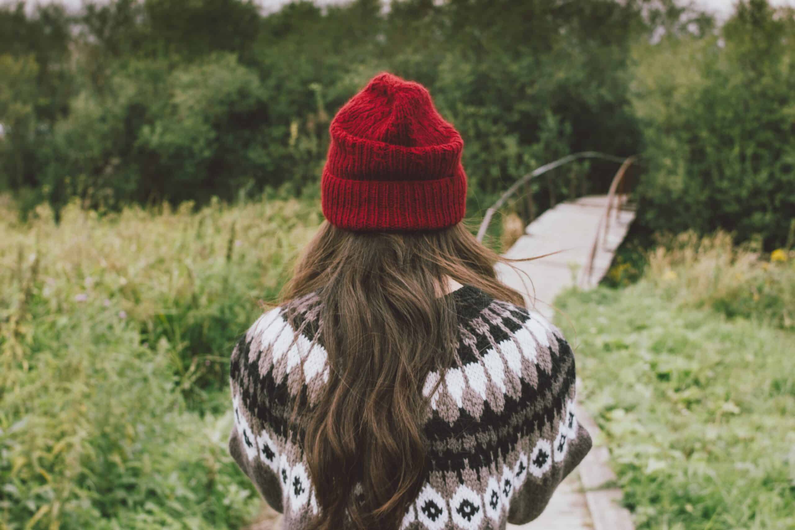 beautiful carefree long hair asian girl in the red hat and knitted nordic sweater in autumn nature t20 1Qadln scaled